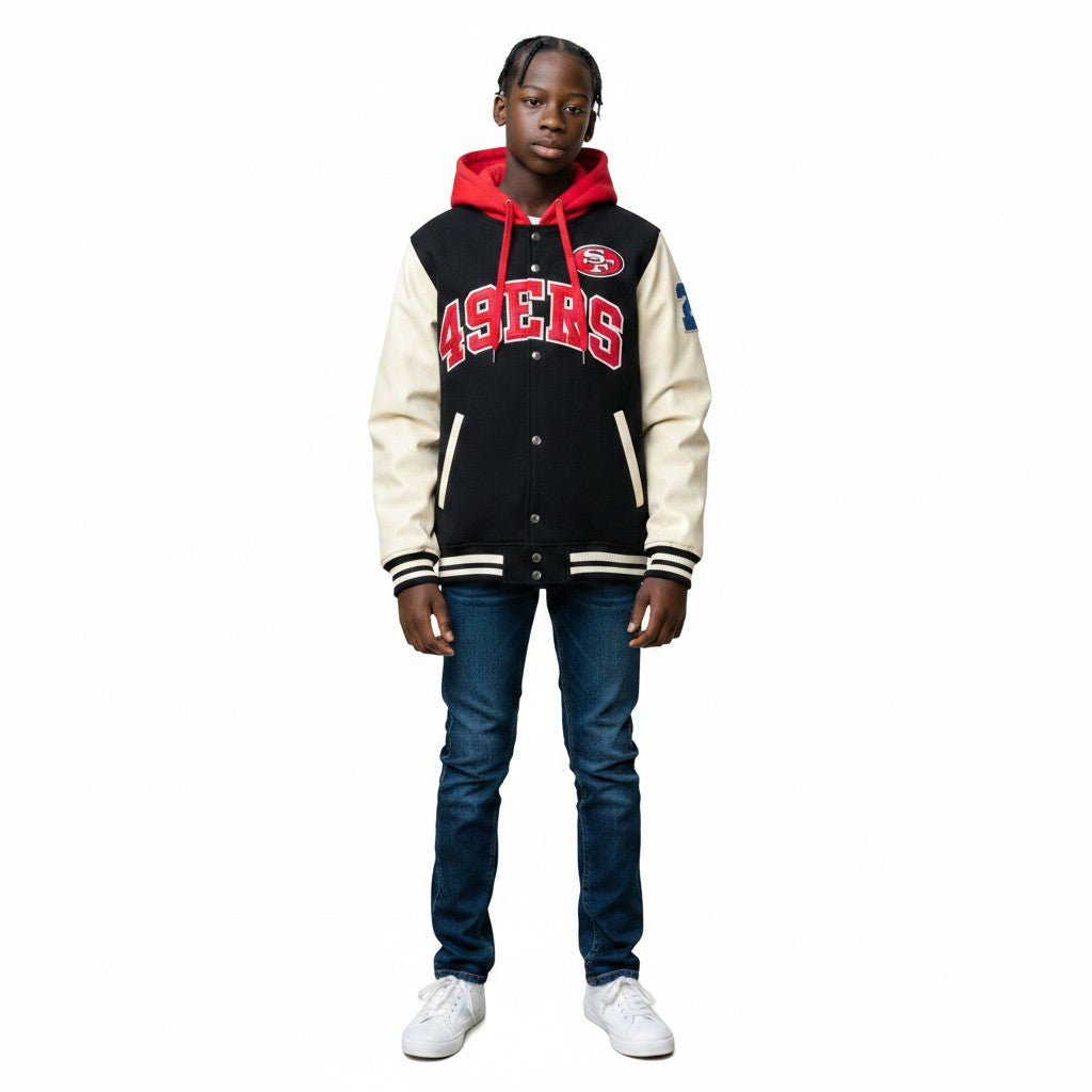 Young boy wearing a Coliseum Sports Mitchell & Ness San Francisco 49ers varsity-style fleece hoodie with red hood.