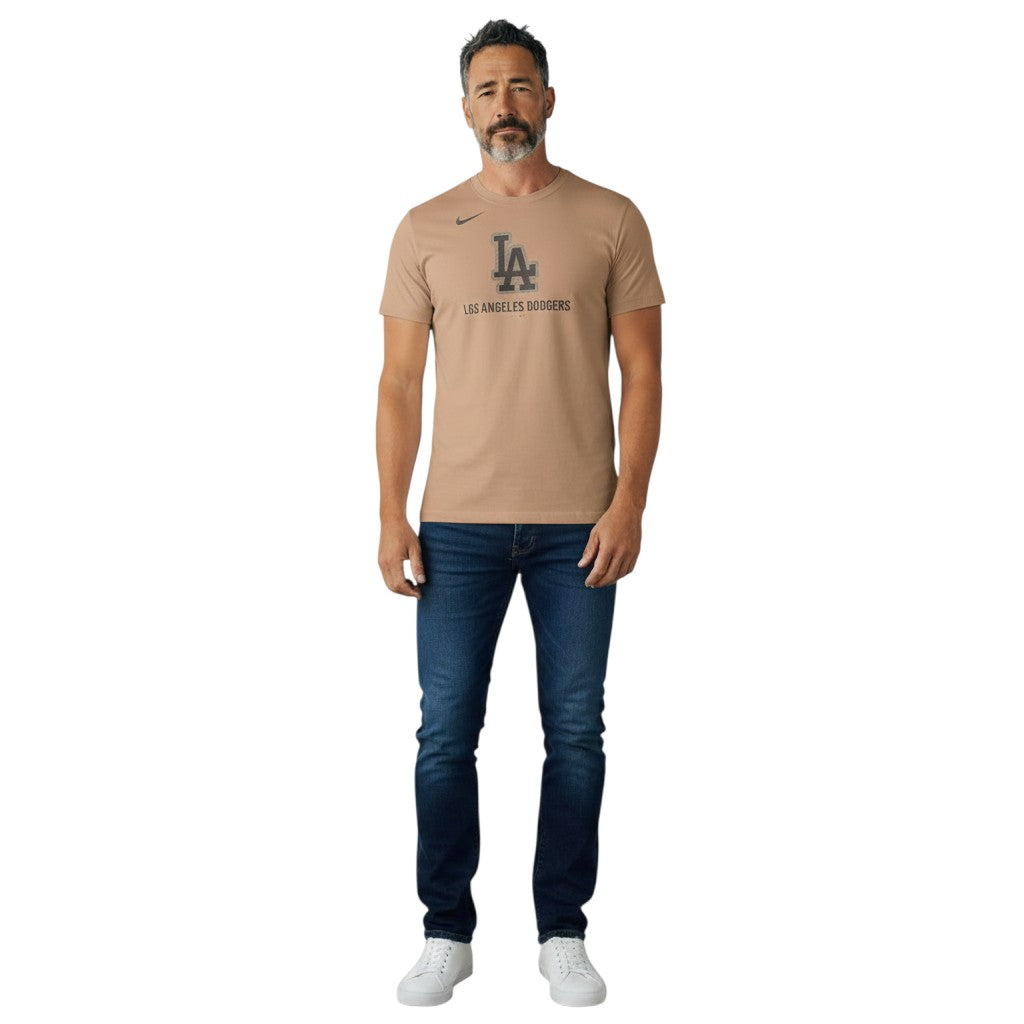 Coliseum Sports Nike Los Angeles Dodgers hemp cotton-blend t-shirt worn by a man with dark jeans and white sneakers.