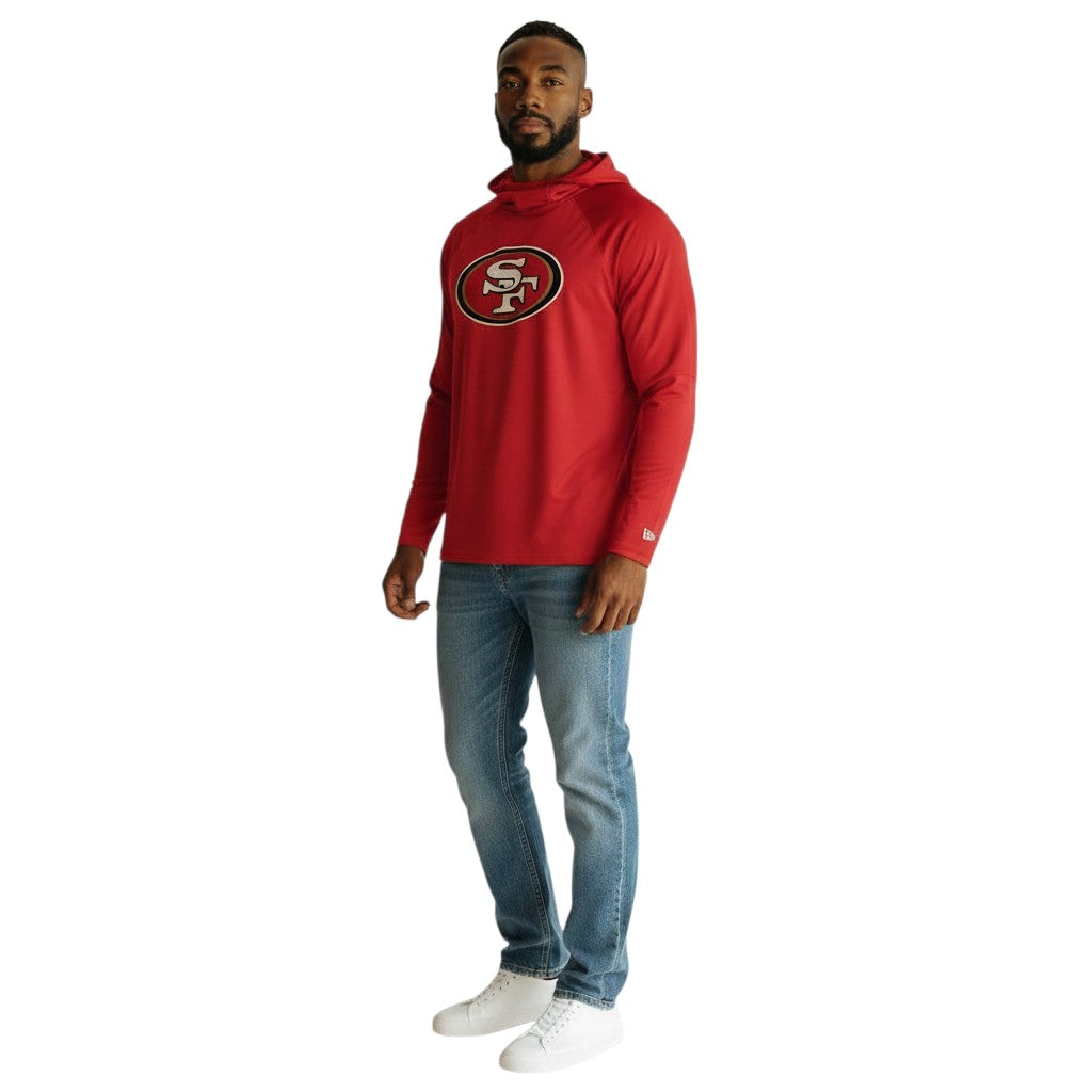Coliseum Sports San Francisco 49ers red balaclava hoodie worn by a man with blue jeans and white sneakers