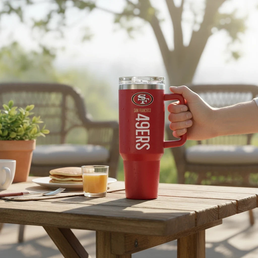 Coliseum Sports San Francisco 49ers 40 oz red stainless steel tumbler with handle and flip straw on outdoor table