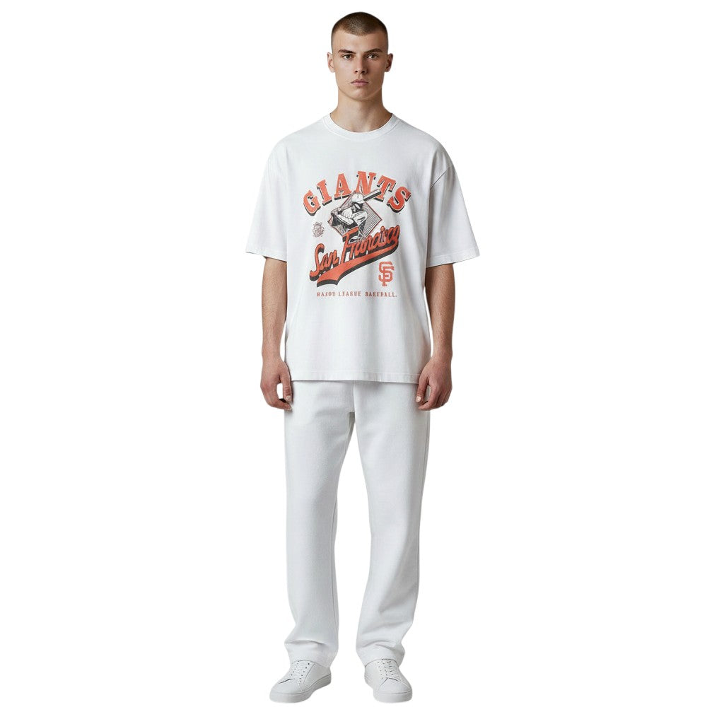 New Era San Francisco Giants white graphic t-shirt worn by a male model with matching white pants.